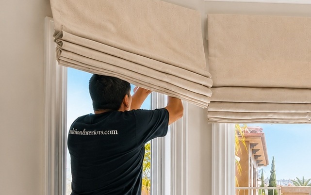 Custom roman shade installer fixing the product in the bathroom.